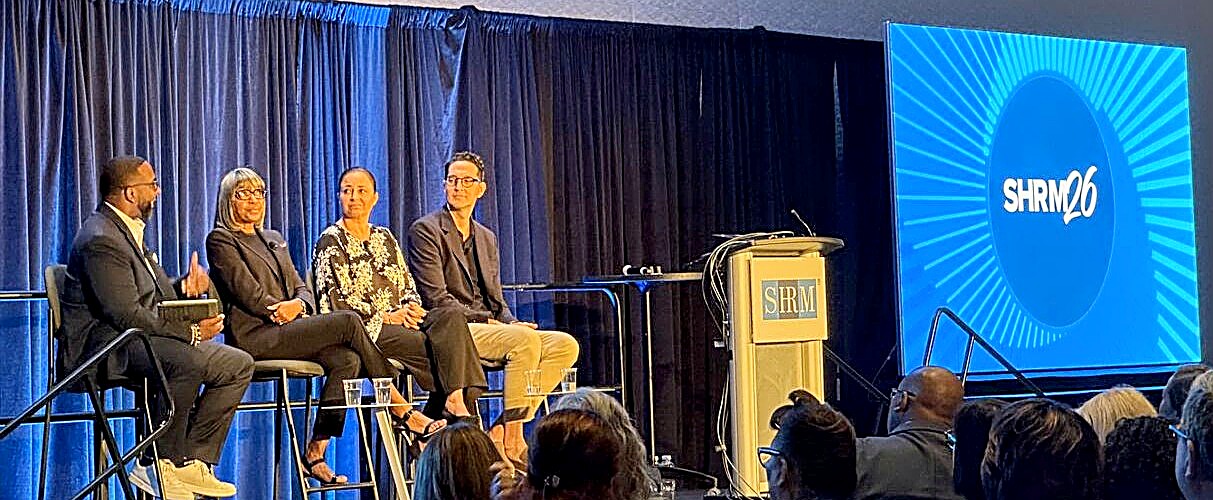 Panel discussion on stage at SHRM26